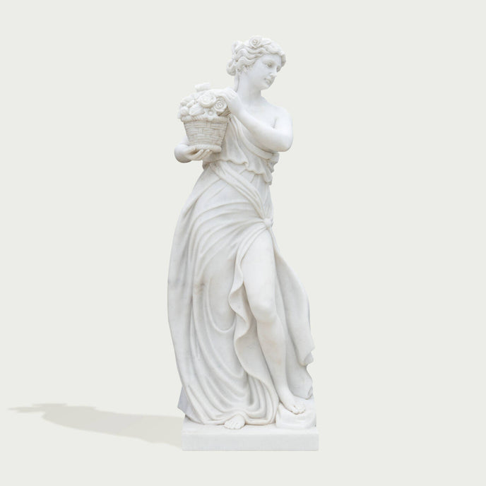 Classic Four Seasons Flora Marble Statue With Flower Basket on a white background.