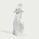 Classic Four Seasons Flora Marble Statue With Flower Basket on a white background.