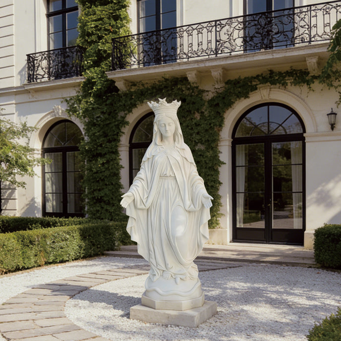 Crowned Our Lady of Grace White Marble Statue in front of an elegant building with ivy