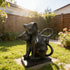 Modern Black Natural Marble Cats Statue  in a garden setting