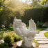 Sleeping Angel In Hands Natural Marble Statue in a garden setting