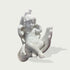 Sleeping Angel In Hands Natural Marble Statue on a hand against a light gray background