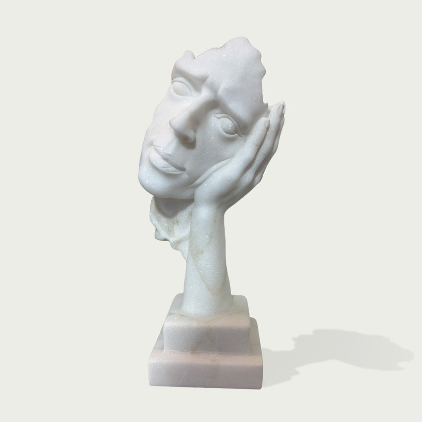 Fragmented Face Marble Sculpture on a white background