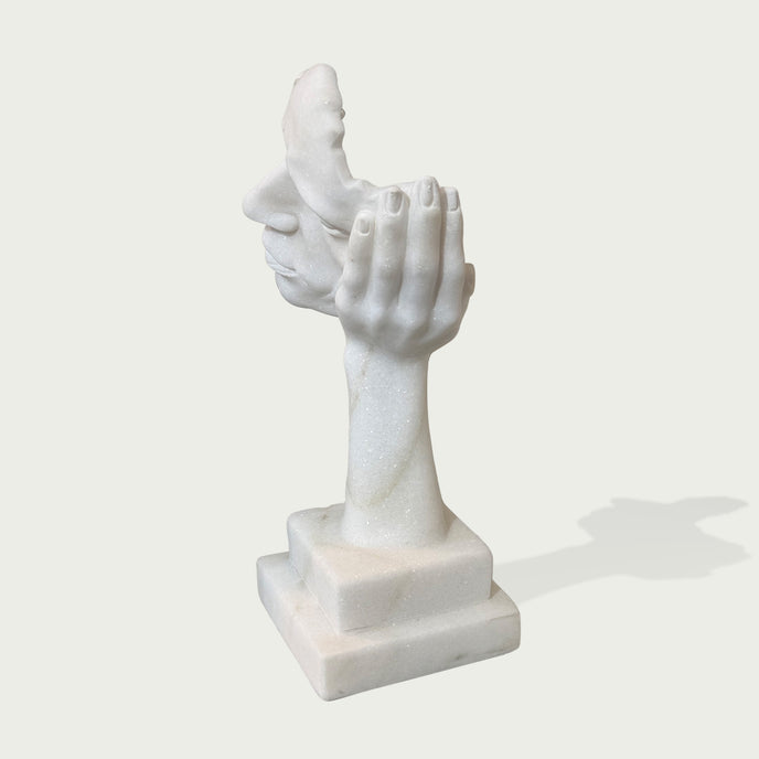 Fragmented Face Marble Sculpture on a white background