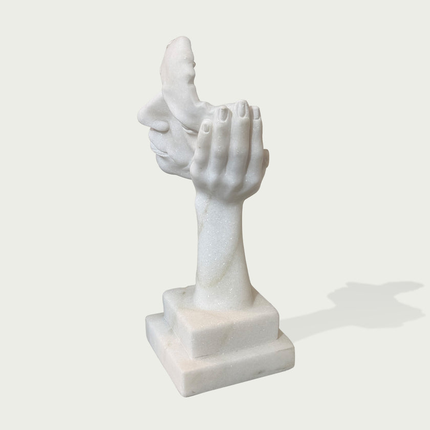 Fragmented Face Marble Sculpture on a white background