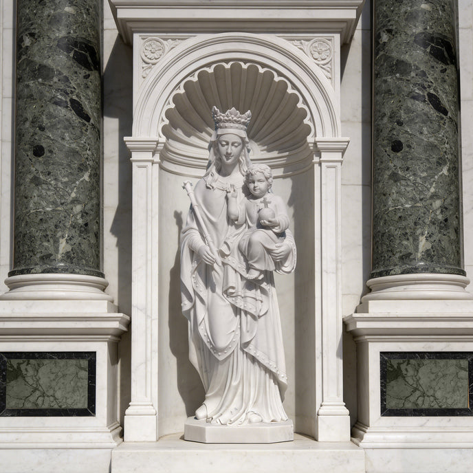 Virgin Mary And Child Marble Statue Outdoor Sculpture in an architectural setting with columns and decorative archway.