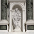 Virgin Mary And Child Marble Statue Outdoor Sculpture in an architectural setting with columns and decorative archway.