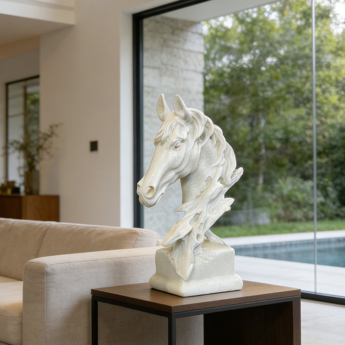 Classic Horse Sculpture Head Bust Sculpture on a table in a modern living room with a view of a pool and garden.