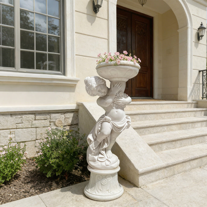Natural white marble cherub planter statue filled with flowers, displayed near villa steps for elegant garden entrance decor.