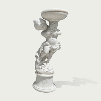 Natural white marble cherub flower planter statue with floral carving, flowing drapery, and decorative bowl on a clean background.