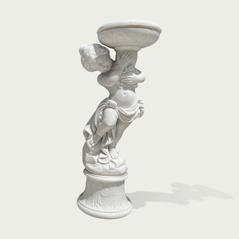 Natural white marble cherub flower planter statue with floral carving, flowing drapery, and decorative bowl on a clean background.