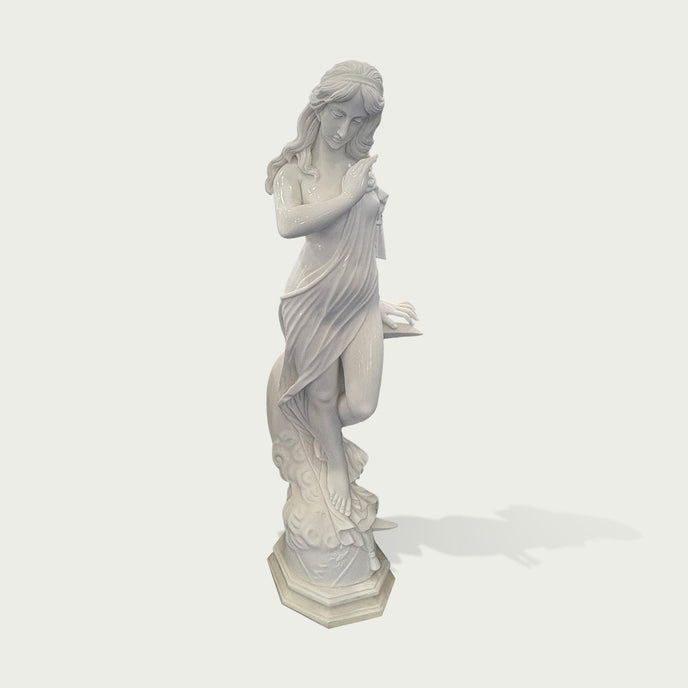 White marble female sculpture with graceful drapery, calm expression, and carved wave details shown on a clean product background.