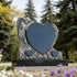 Angel heart memorial headstone displayed in a cemetery garden, featuring rose carvings, black granite base, and a peaceful tribute design for loved ones.