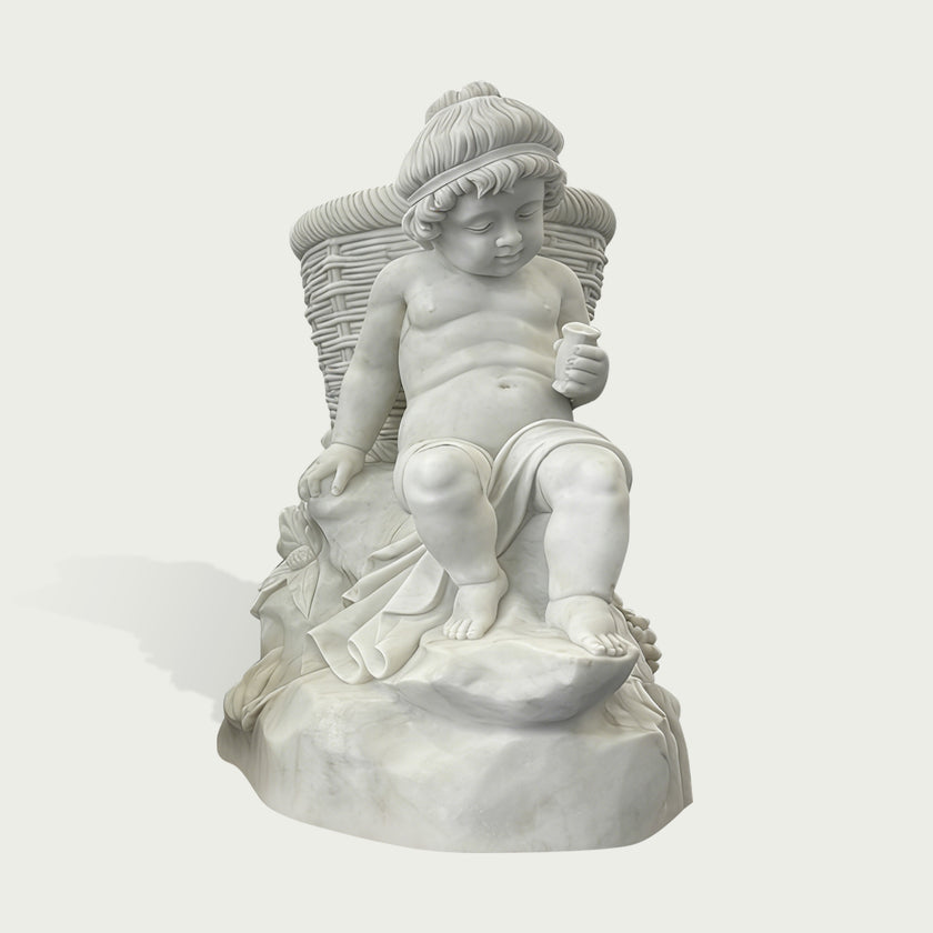 Natural white marble child statue seated with a woven basket, small cup, draped cloth, and fruit details on a clean background.