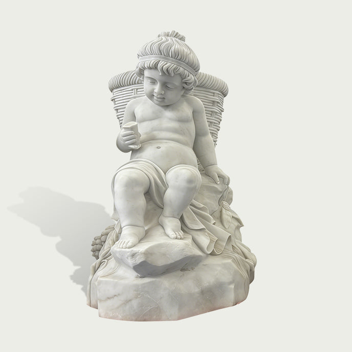 Natural white marble seated child sculpture with basket texture, fruit carving, soft drapery, and gentle downward gaze on a clean background.