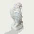 Side back view of white marble praying cherub angel sculpture showing layered wing carvings, curled hair, and kneeling position.