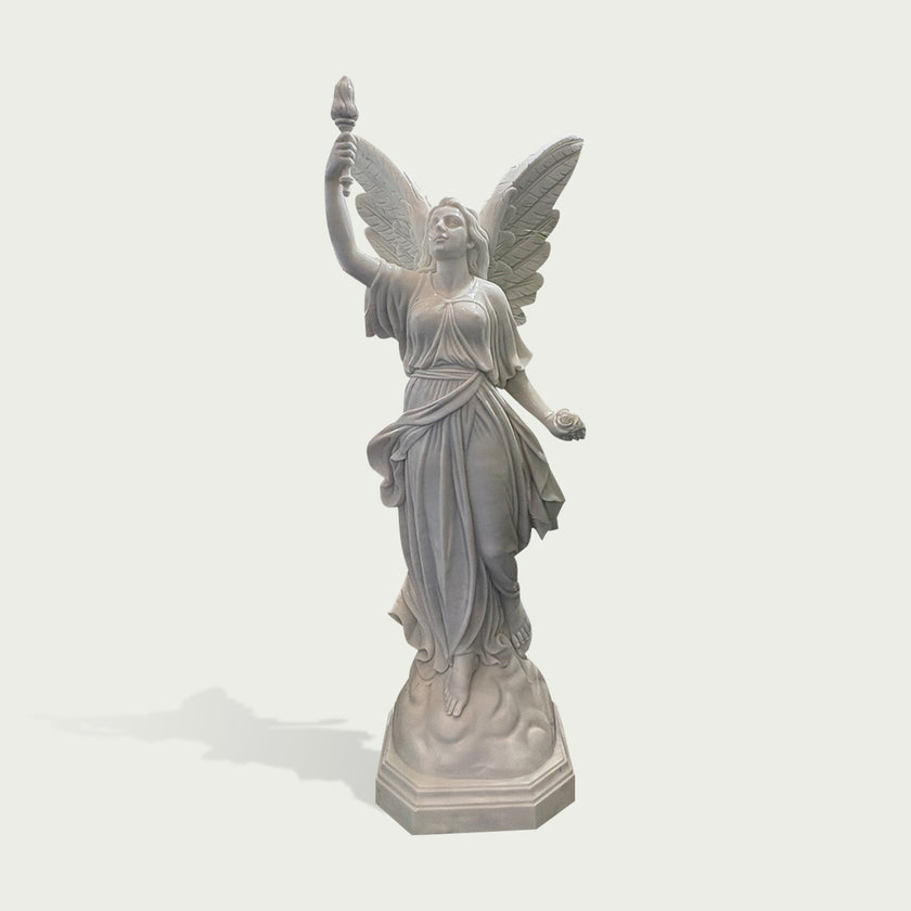 Natural white marble angel sculpture with raised torch, rose detail, large feathered wings, and classical flowing robe on a clean background.