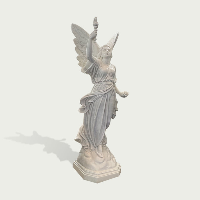 Side view of white marble angel statue with torch, rose, open wings, and wind-swept drapery carved in a classical style.