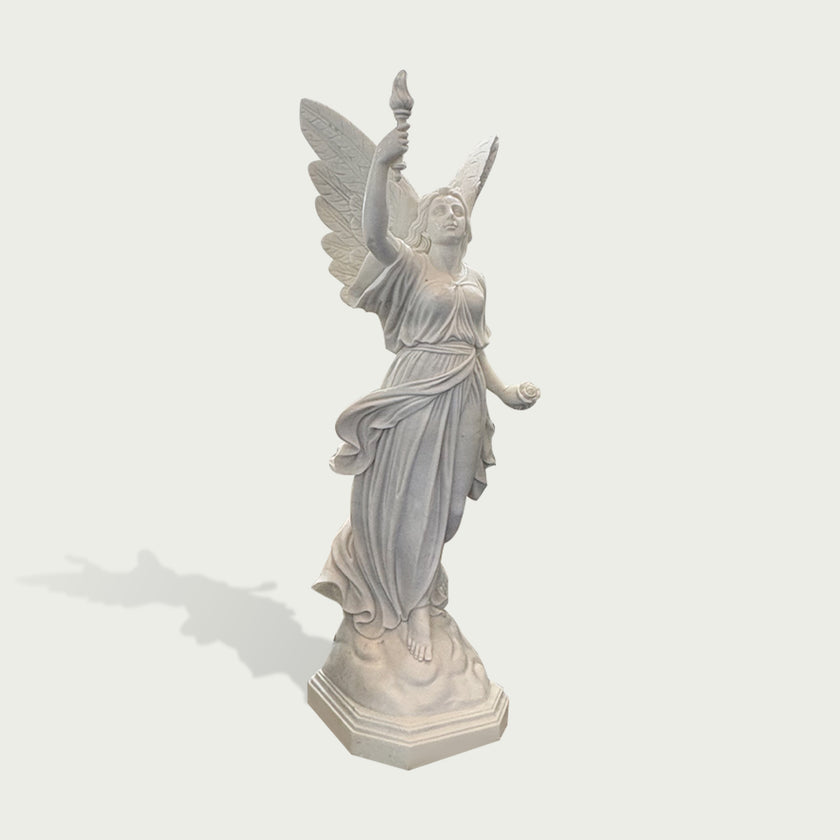 Side view of white marble angel statue with torch, rose, open wings, and wind-swept drapery carved in a classical style.