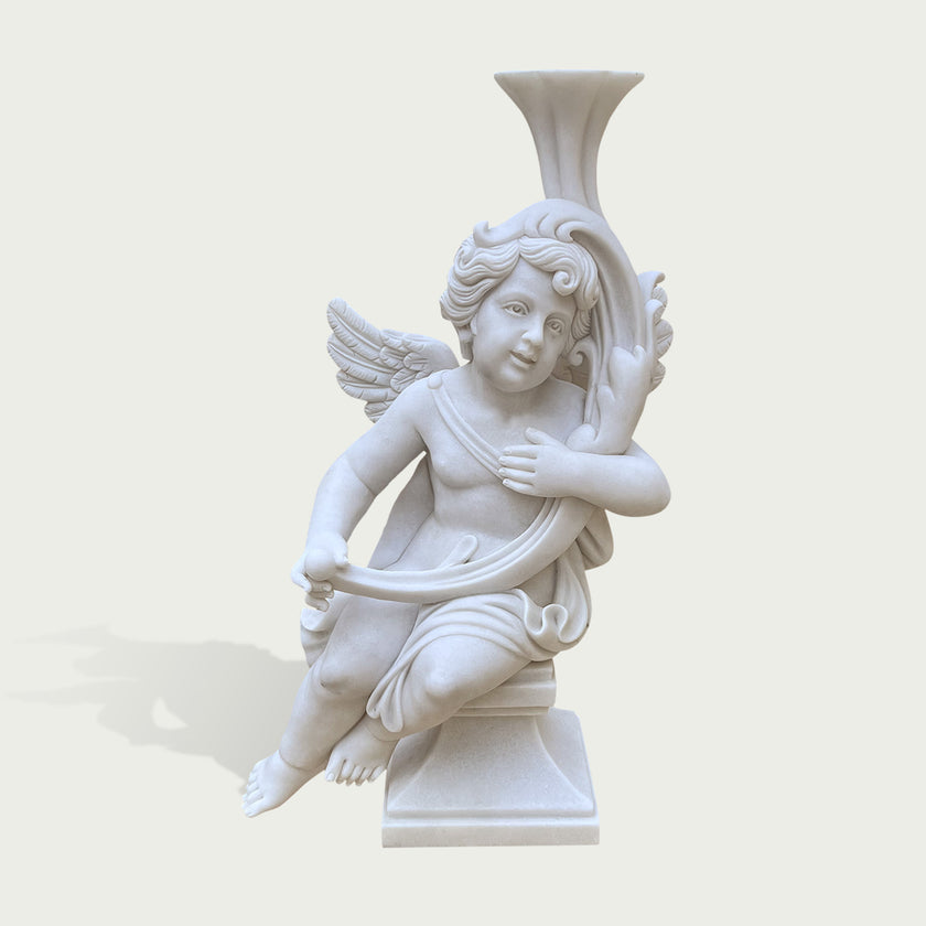 A white classical-style cherub statue holding a curved vase, shown against a plain light beige background.