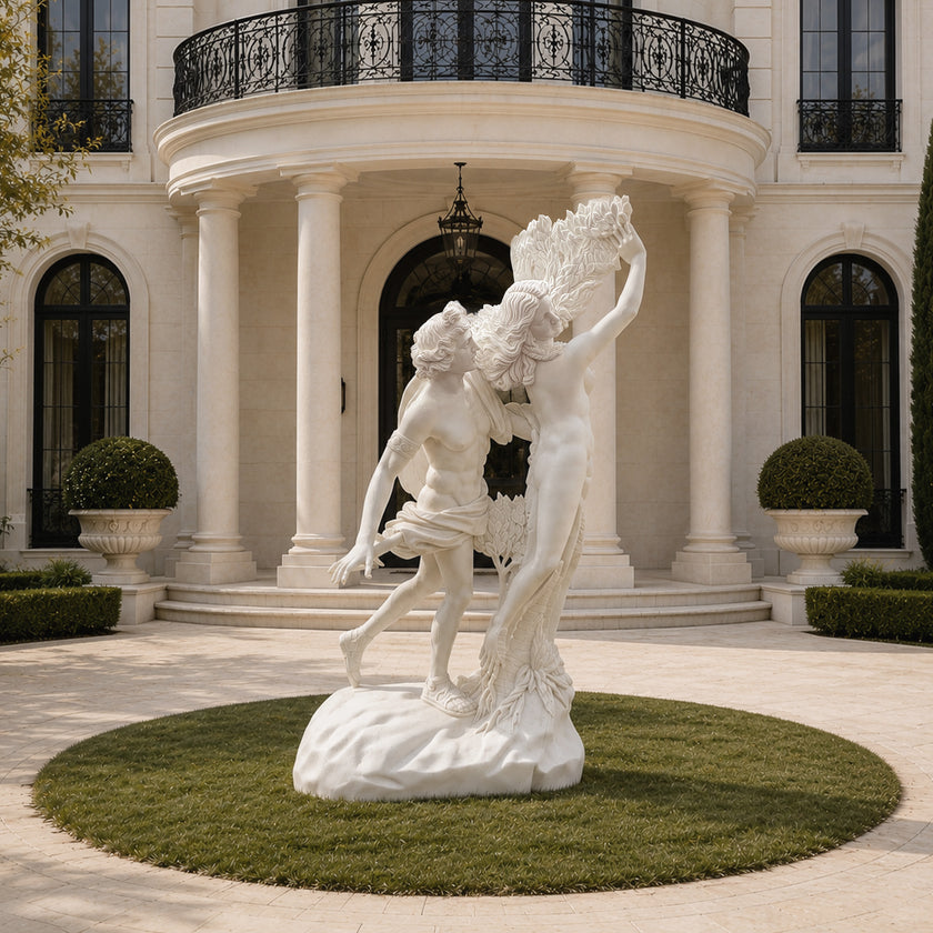Natural white marble Apollo and Daphne sculpture showing intertwined figures, flowing drapery, and laurel branches during the dramatic transformation scene.