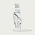A white classical-style statue of a draped female figure standing on a round base, photographed against a plain light gray background with a soft shadow.