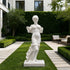 White marble female statue with flowing drapery displayed in a luxury garden courtyard, classical sculpture with elegant carved details