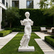 White marble female statue with flowing drapery displayed in a luxury garden courtyard, classical sculpture with elegant carved details