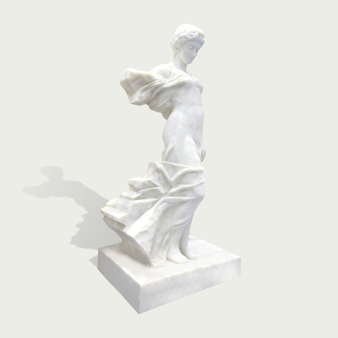 Side view of elegant white marble female sculpture with flowing fabric details and classical artistic design