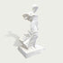 Side view of elegant white marble female sculpture with flowing fabric details and classical artistic design