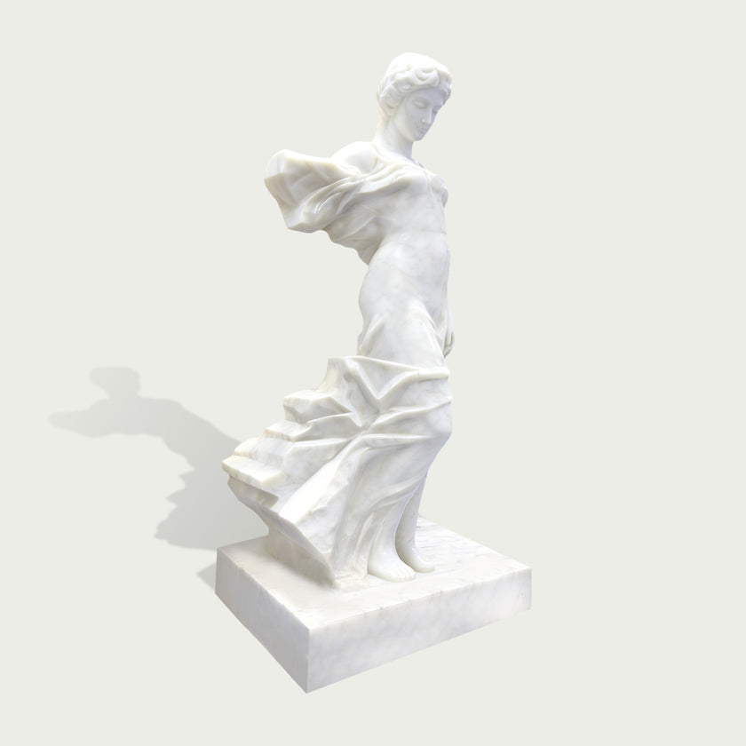 Side view of elegant white marble female sculpture with flowing fabric details and classical artistic design