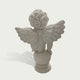 Back view of a white marble cherub angel sculpture showing detailed feathered wings and handcrafted stone carving
