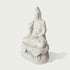 Side view of a white marble Guanyin sculpture showing detailed flowing robes, lotus base, and handcrafted stone carving craftsmanship