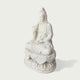 Side view of a white marble Guanyin sculpture showing detailed flowing robes, lotus base, and handcrafted stone carving craftsmanship