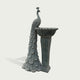Grey marble peacock water fountain sculpture with intricate feather carvings and timeless architectural garden ornament style