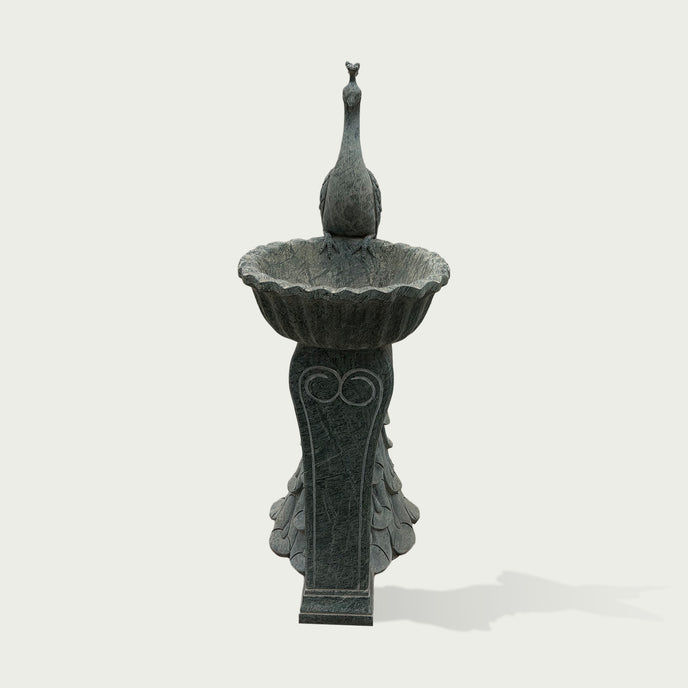 Front view of grey marble peacock fountain sculpture featuring carved bird details and classic garden fountain design