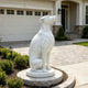 White marble greyhound garden statue displayed outdoors, adding timeless elegance to a modern landscape and home entrance.