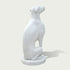 Back view of a white marble greyhound statue displaying smooth curves, detailed form, and handcrafted stone sculpture quality.