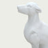 Close-up view of a white marble greyhound sculpture head with elegant features and polished stone carving details.