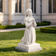 White marble praying girl statue displayed in a garden setting, featuring elegant carved details, flowing robes, and peaceful devotional design.