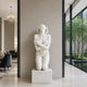 White marble kneeling woman sculpture with elegant classical form and artistic details for luxury interior decoration
