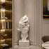 White marble face sculpture displayed in a stylish living room with contemporary design and timeless artistic beauty