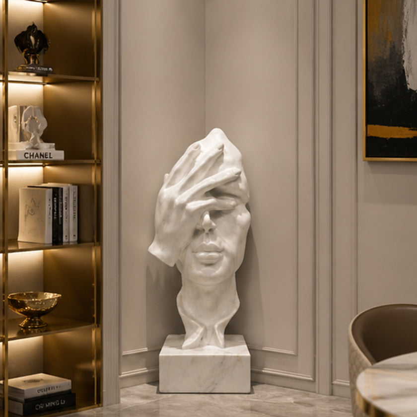 White marble face sculpture displayed in a stylish living room with contemporary design and timeless artistic beauty