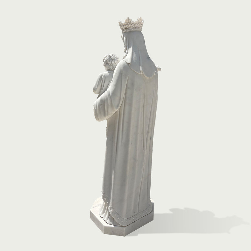 Back view of white marble Virgin Mary holding Child Jesus sculpture, showing detailed flowing robes, crown design, and handcrafted religious statue details