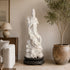 White marble Guanyin statue sculpture with flowing robes and intricate dragon carvings at the base, showcasing traditional Buddhist artistry and elegant handcrafted stone details