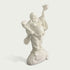 Side angle view of white stone Laughing Buddha sculpture showing detailed robe folds, balanced pose, expressive face and artistic carved pedestal design
