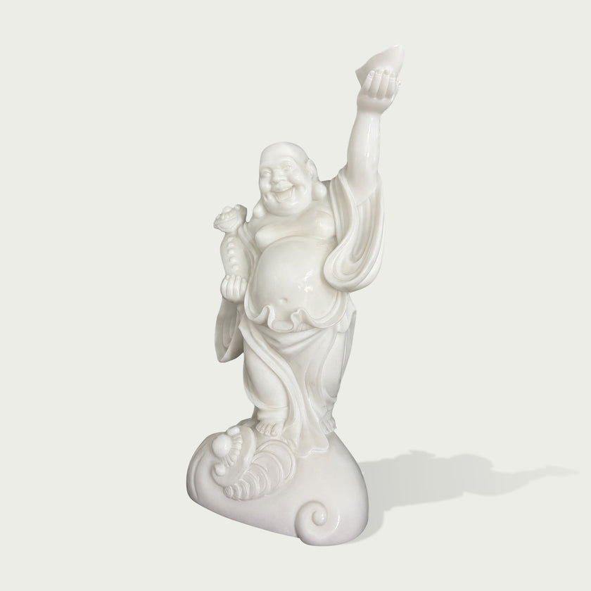 Front view of handcrafted white marble Laughing Buddha statue with round belly, cheerful smile, raised arm and smooth polished stone finish