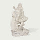 Front view of a white marble Laughing Buddha riding a fish sculpture, featuring detailed scales, flowing robes, and elegant carving for feng shui garden decor.