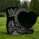 Black granite heart-shaped memorial sculpture with engraved flying doves, mountain landscape, trees, and bridge details, creating a peaceful cemetery tribute monument.