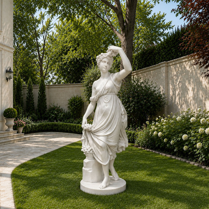 White marble goddess sculpture displayed in a luxury garden, classical female statue with flowing dress and elegant outdoor landscaping